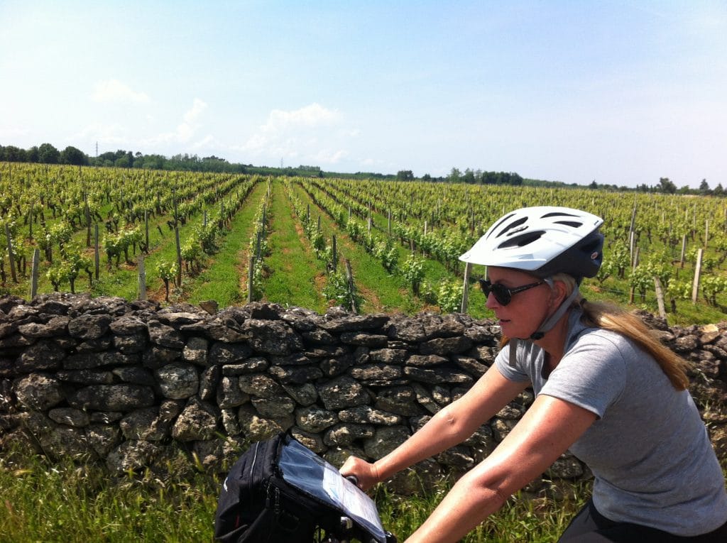 Cycling past vineyards in Bordeaux