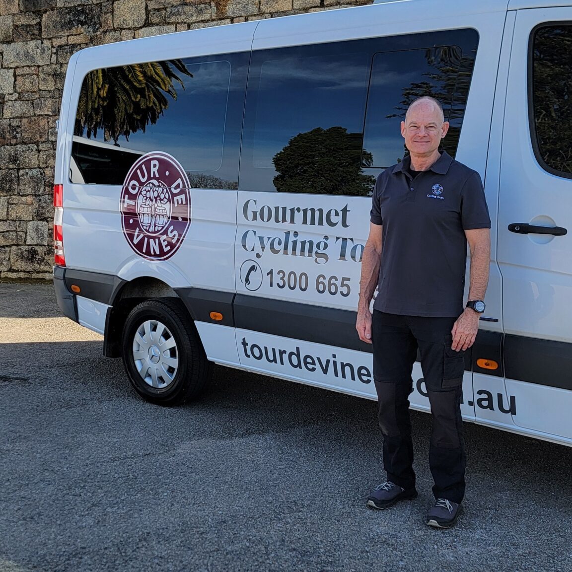 cycling tour guide christian in front of tdv bus
